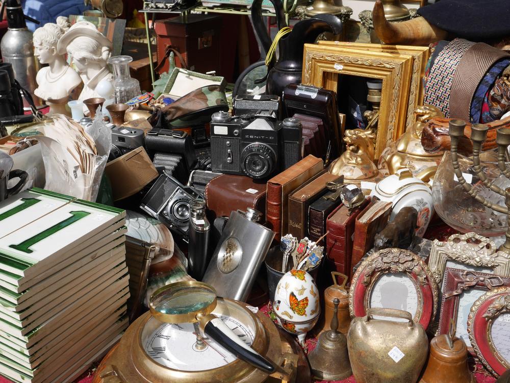image of a flea market table with various items for sale.